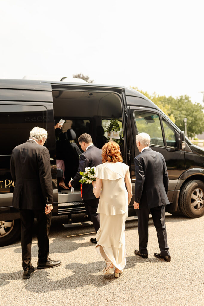 wedding party getting into shuttle post ceremony