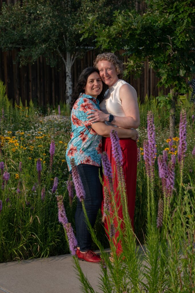 lgbt couple portrait in wildflowers at bell museum 
