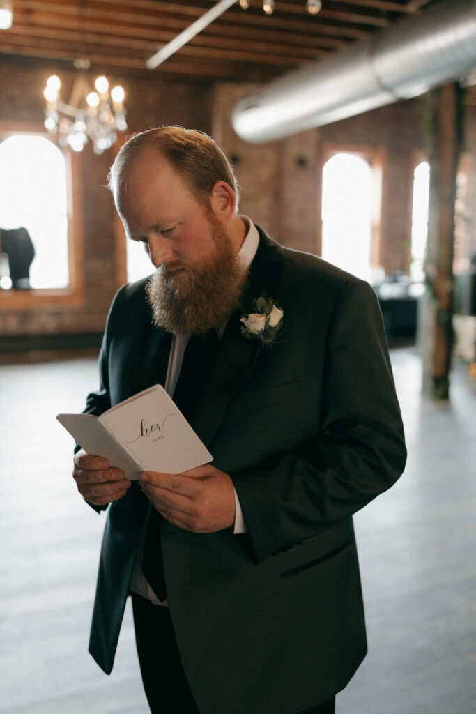groom reading bride's vows