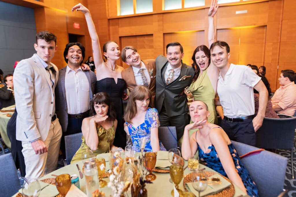 grooms group photo with guests during table dash