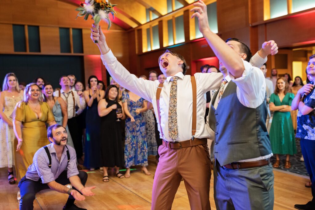 grooms dramatically throwing bouquet