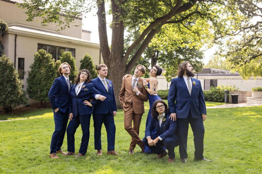 dramatic fun wedding party photo outside