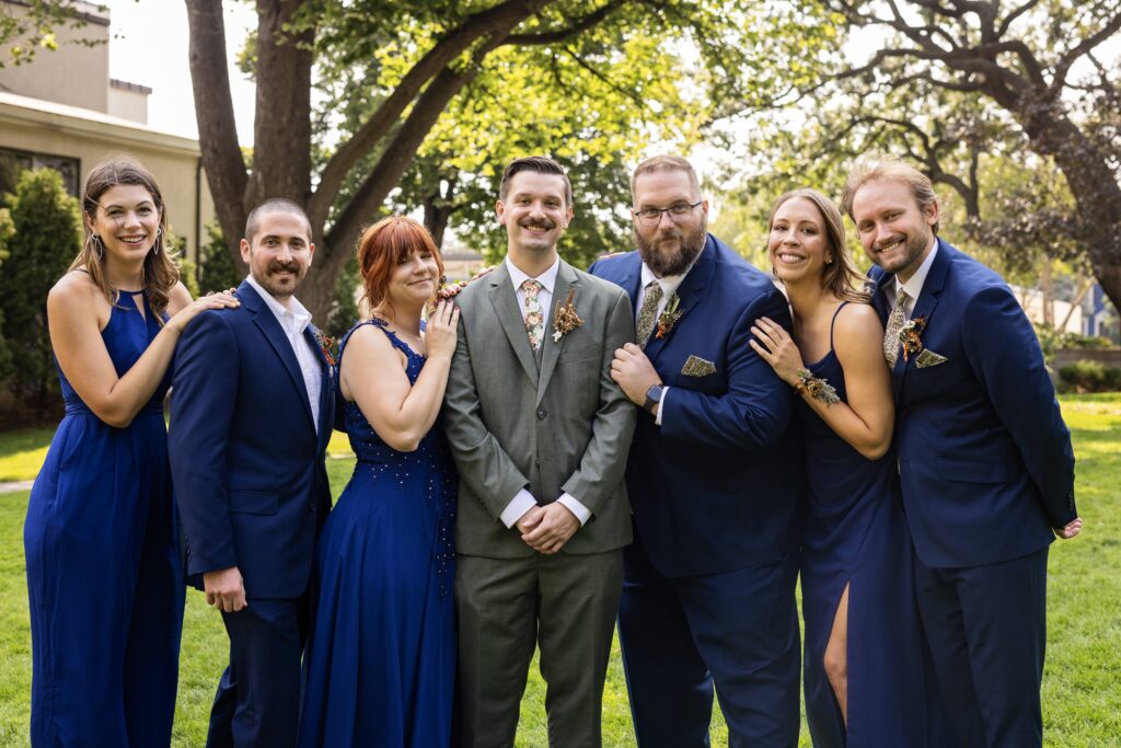 wedding party in royal blue dresses and suits