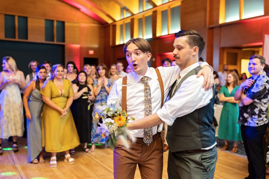 grooms bouquet toss at Minneapolis Institute of Art wedding