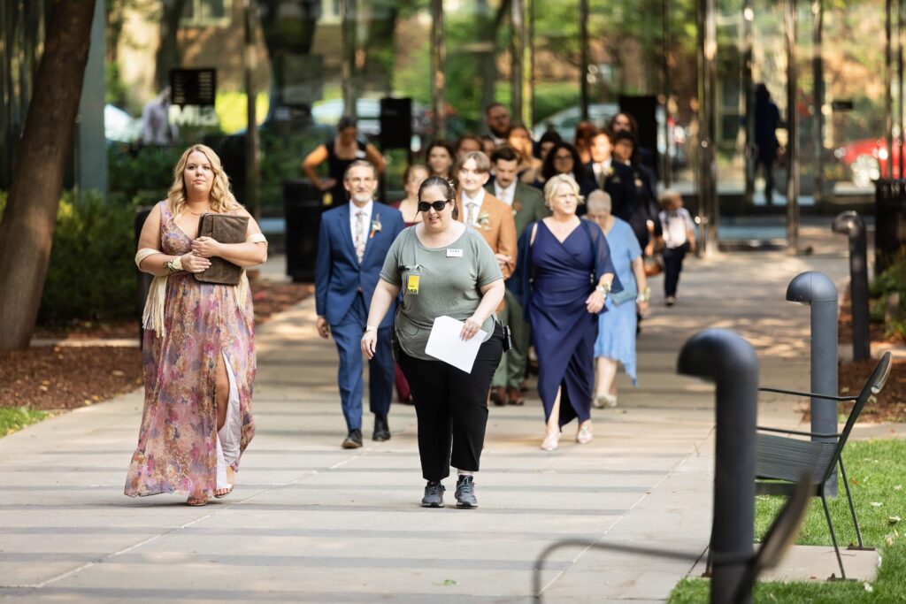 keyed up events wedding planner leading wedding party to ceremony at MIA