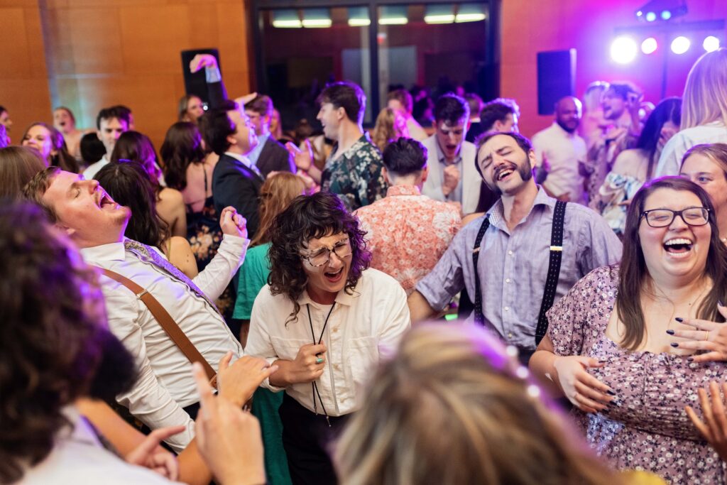 Wedding guests partying on dance floor at Minneapolis Institute of Art