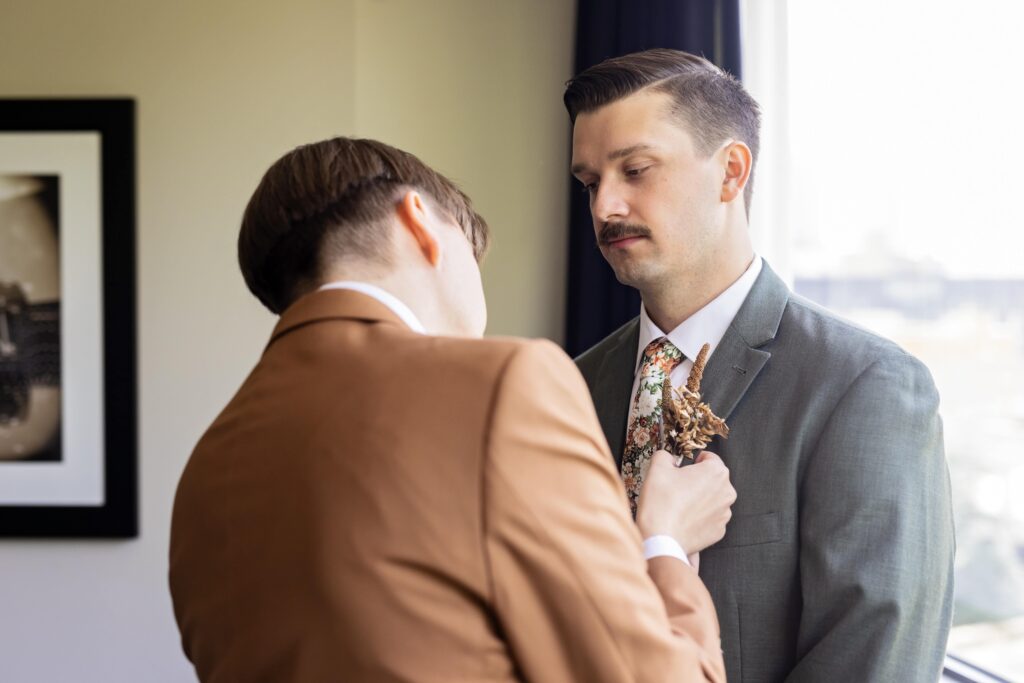 grooms tying ties wedding morning