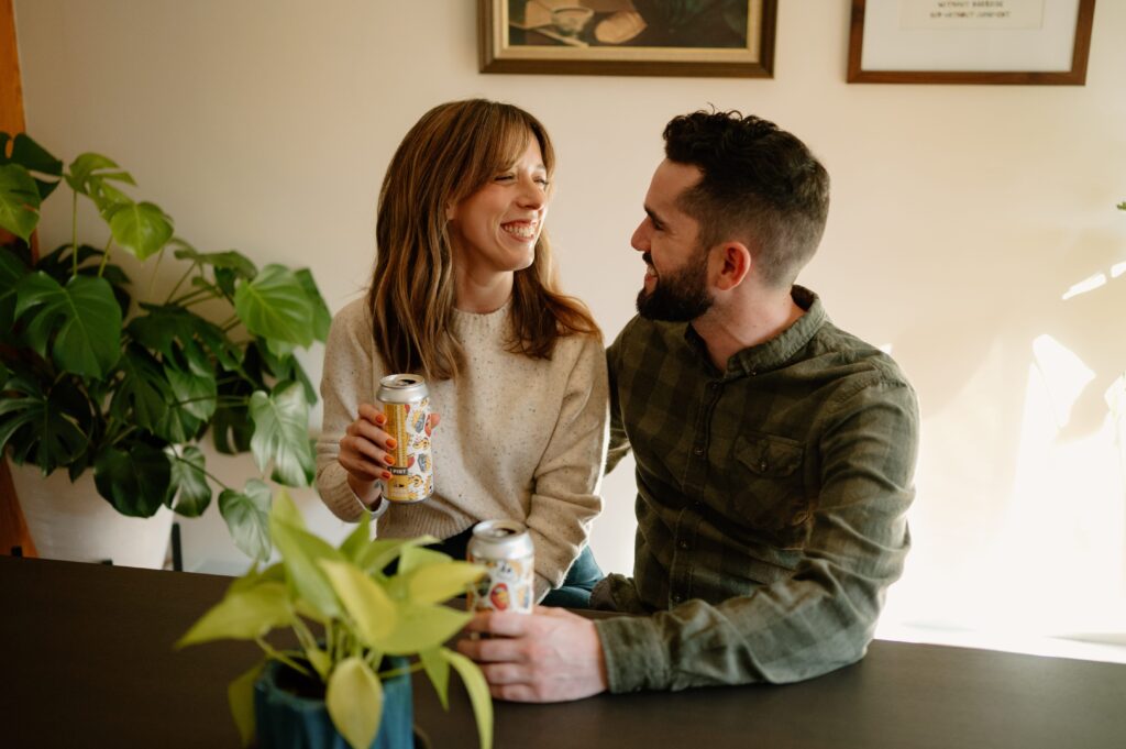 couple documentary style engagement photos in home