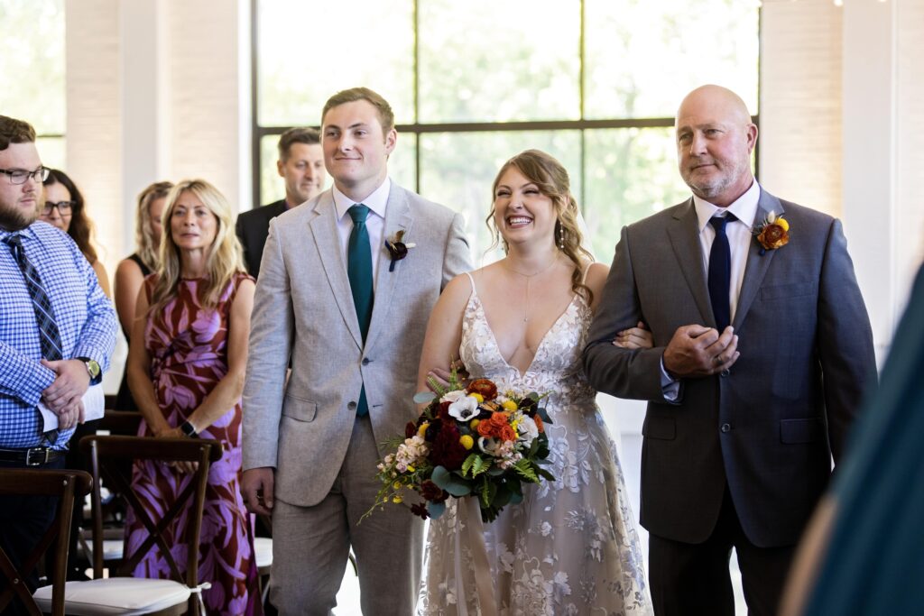 bride escorted by father and brother