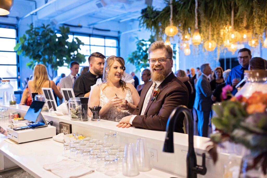 bride and groom at bar at Urban Daisy woodland fairy themed wedding