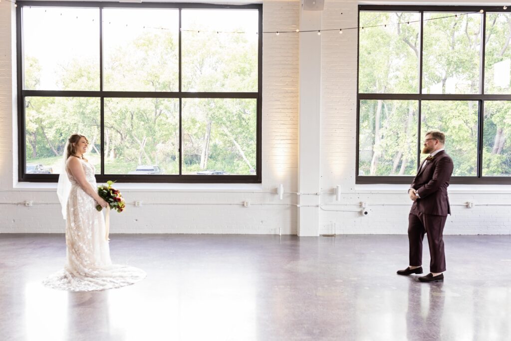 bride and groom first look at Urban Daisy