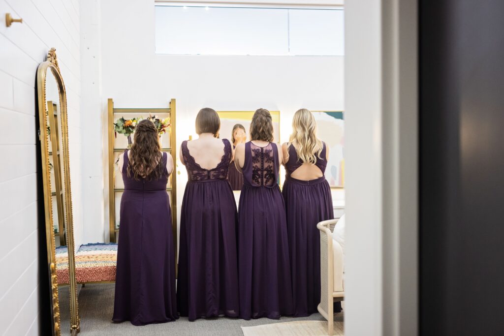 bridesmaids first look with bride at Urban Daisy