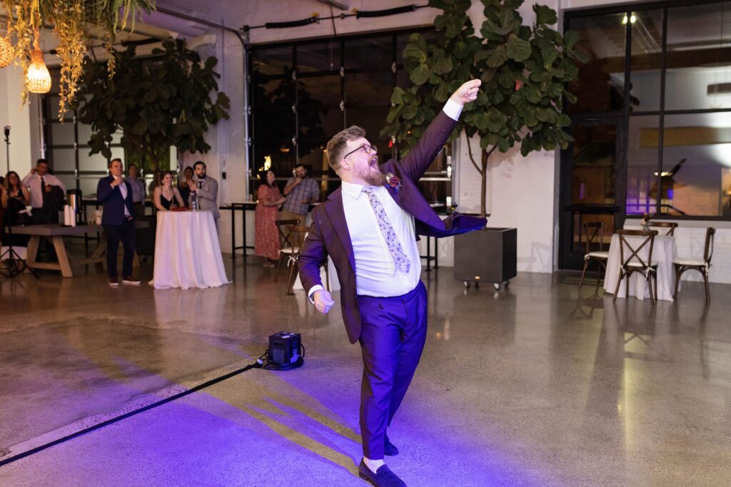 groom lassoing bride for first dance