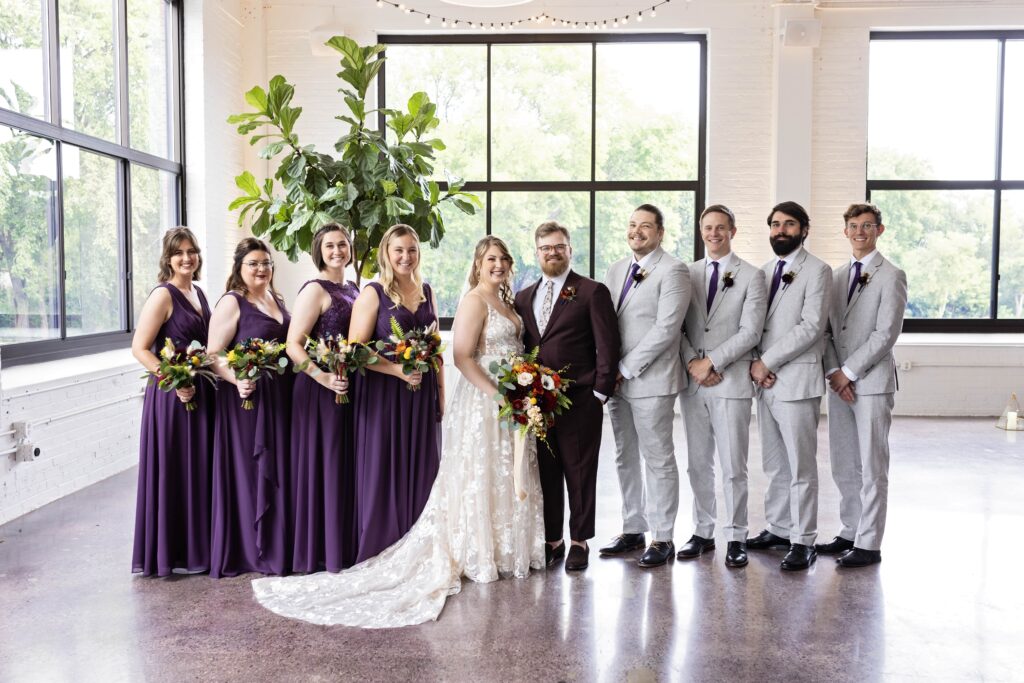 traditional wedding party portrait in purple attire