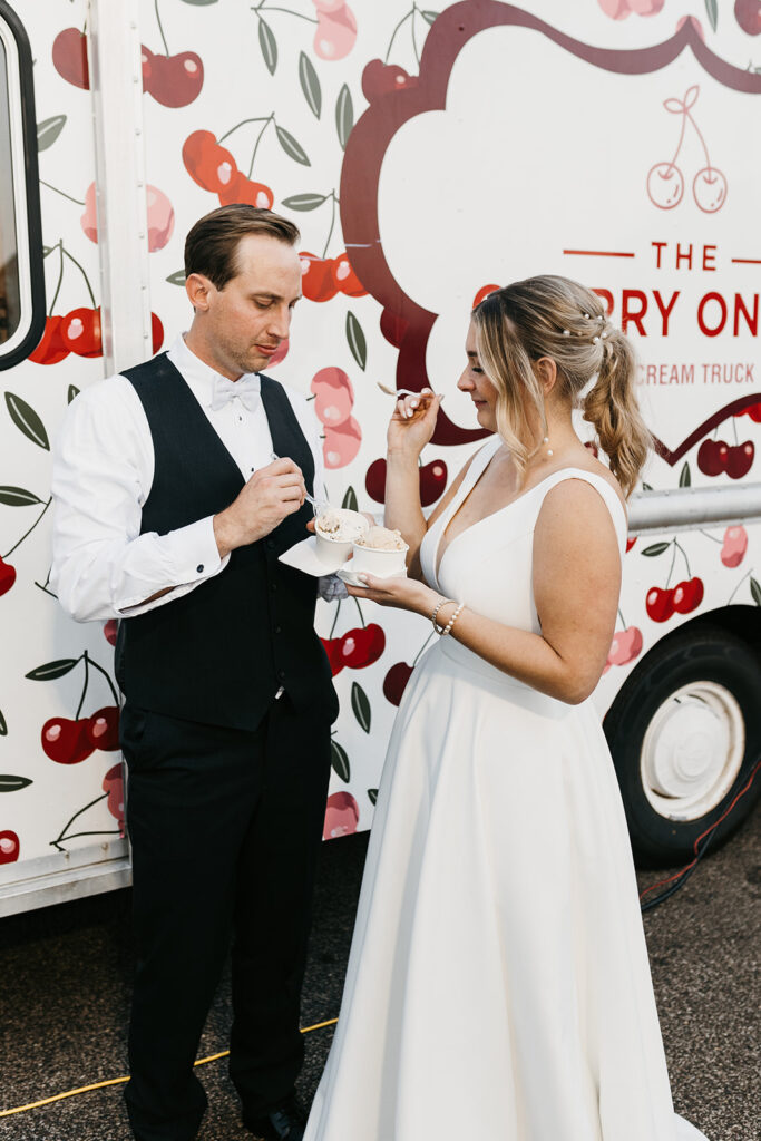 bride and groom eating ice cream for dessert