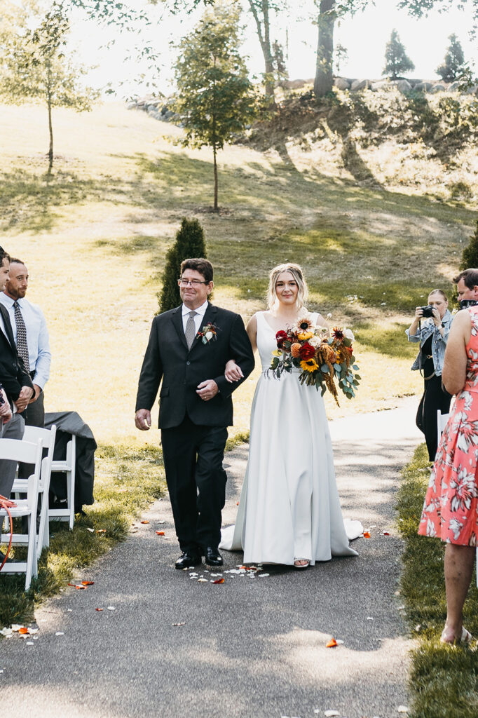 bride walking with dad for Leopold’s Mississippi Gardens ceremony