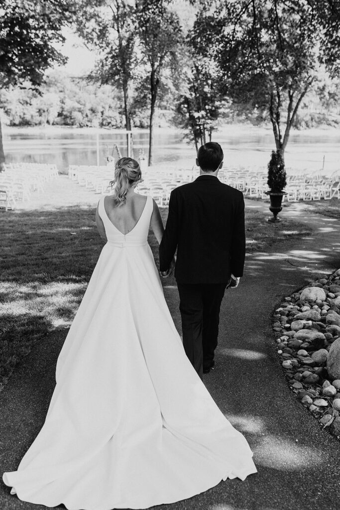 black and white wedding portrait walking through Leopold’s Mississippi Gardens 