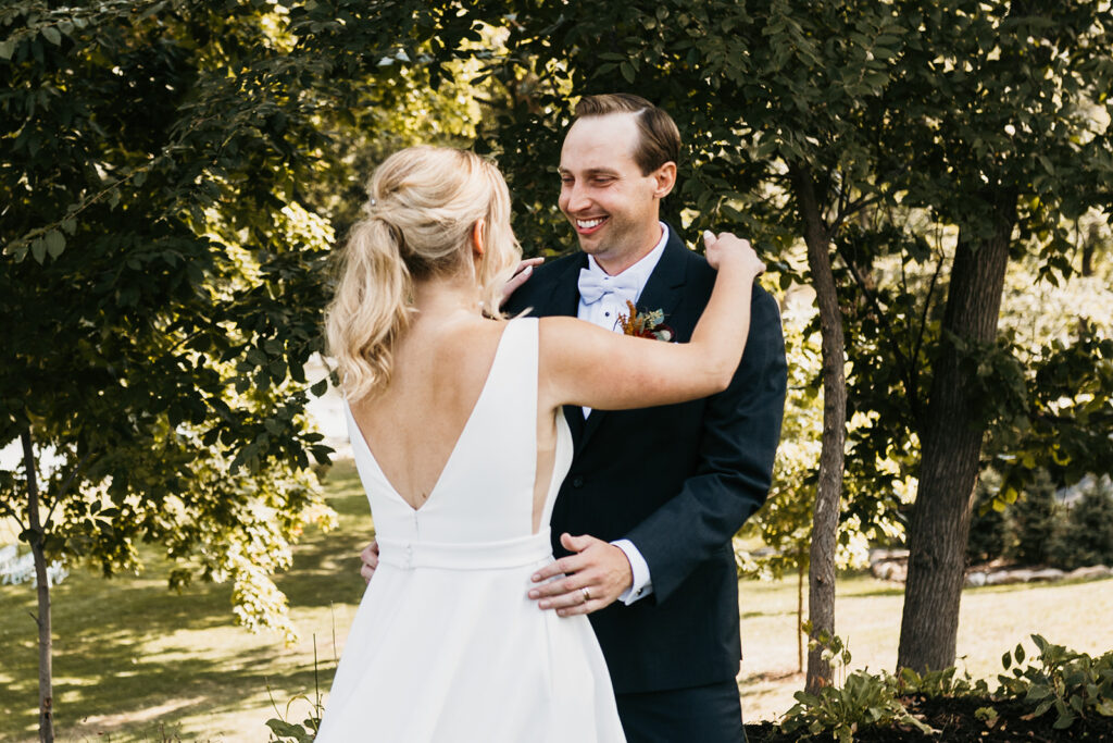 bride and groom emotional first look at Leopold’s Mississippi Gardens 