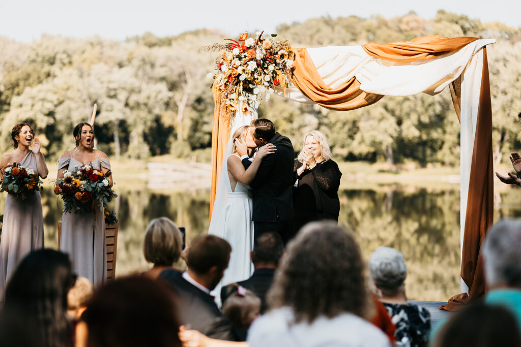 bride and groom ceremony kiss for Leopold’s Mississippi Gardens outdoor ceremony