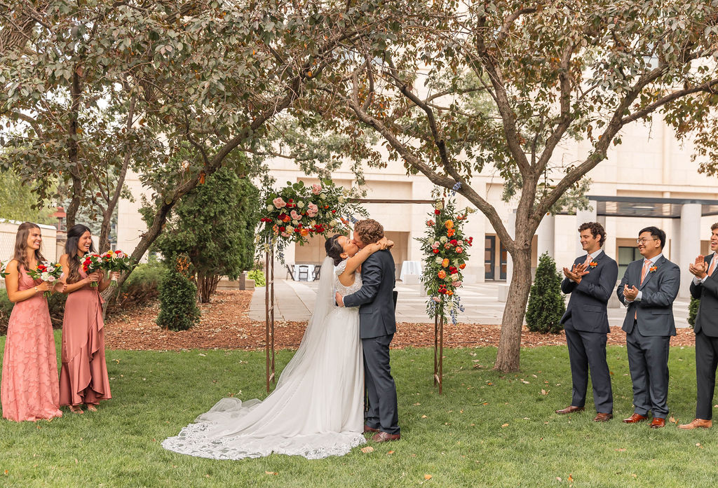 bride and groom ceremony kiss at art museum wedding