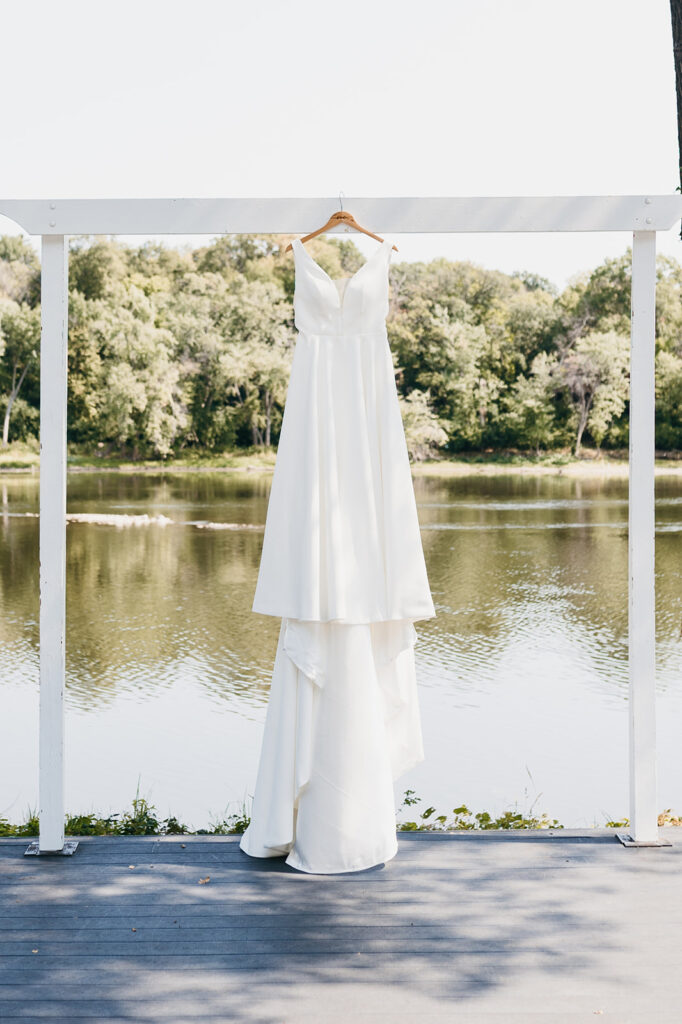 wedding dress hanging outside near Mississippi River