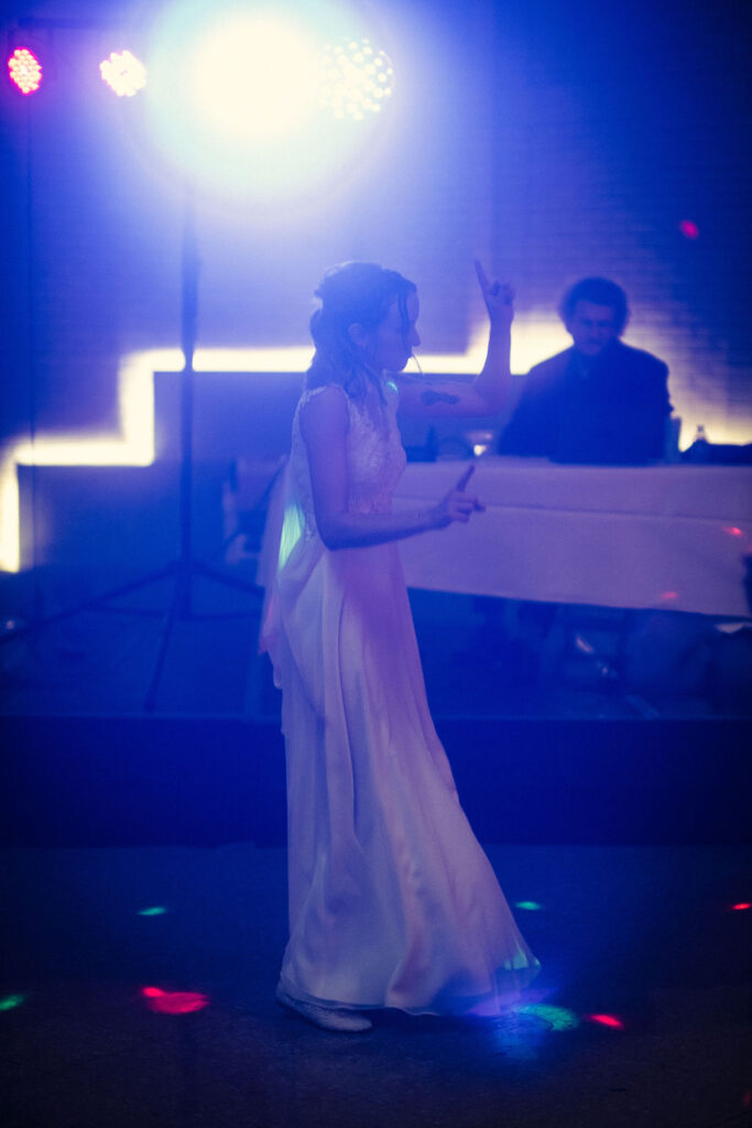 bride dancing on dance floor at Union Depot with bright disco lights