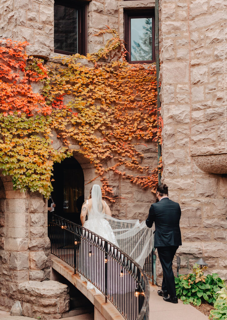 Bride and groom entering Van Dusen Mansion