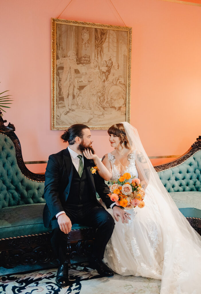 Couple portraits on couch at Van Dusen Mansion 