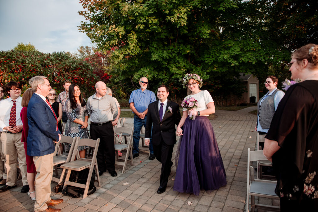 Bride and groom walking down the aisle processional together