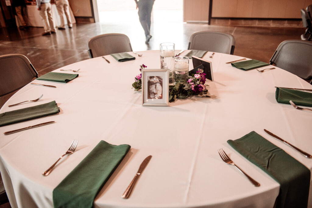 green and purple wedding reception table decor