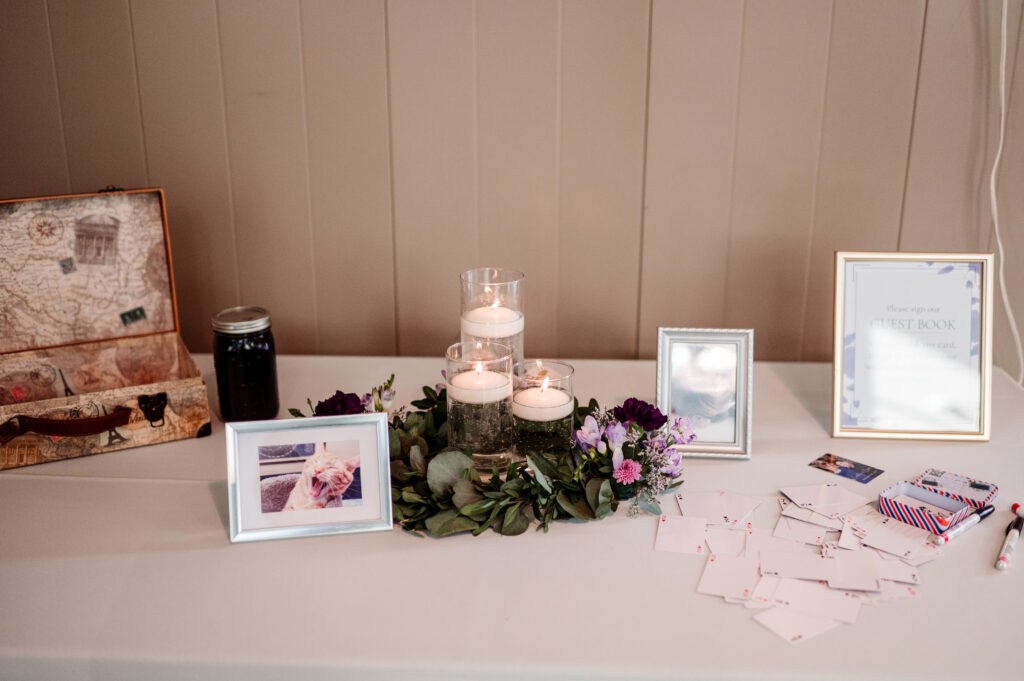 Welcome table at wedding with deck of cards guest book