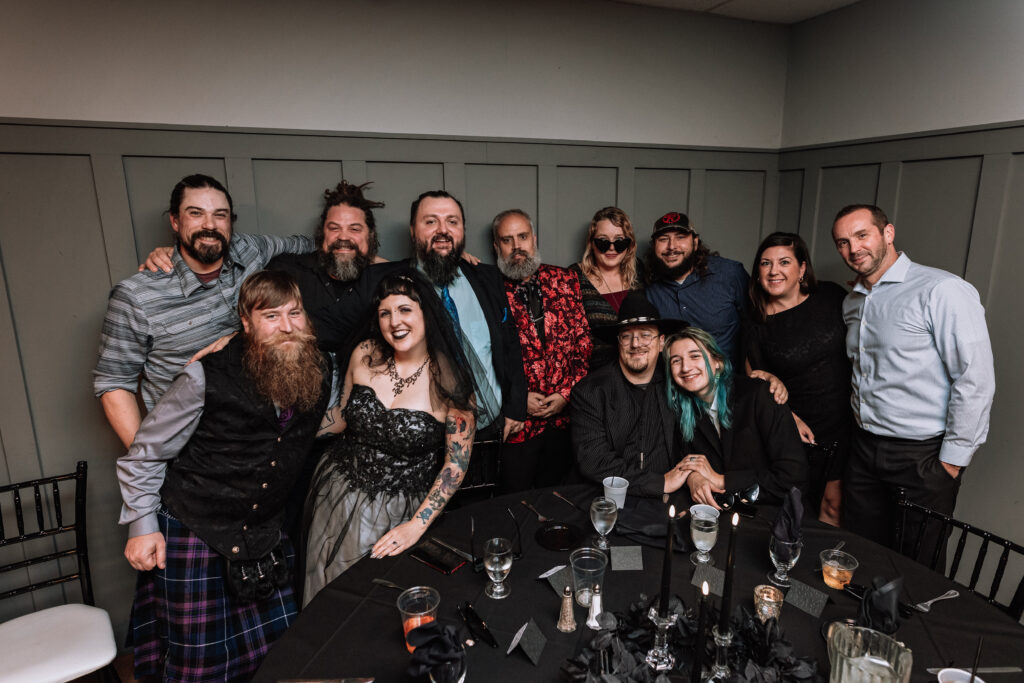 table dash wedding photo with guests