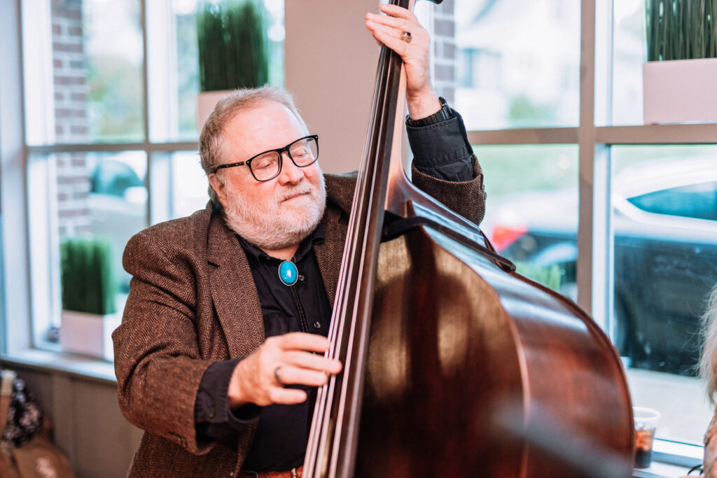 Groom's dad playing live music for wedding ceremony