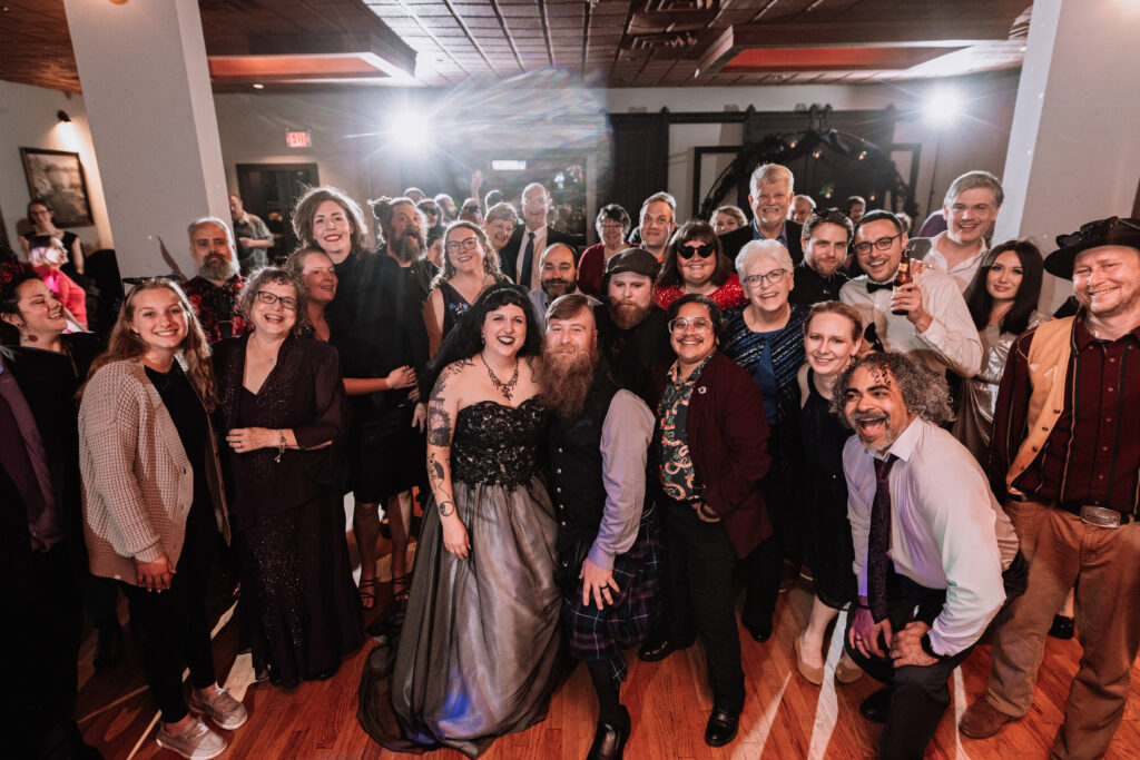 wedding guest group photo on dance floor