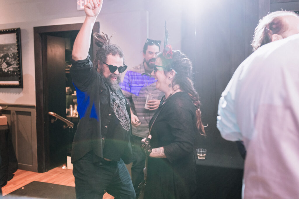 guests dancing on dance floor at wedding reception