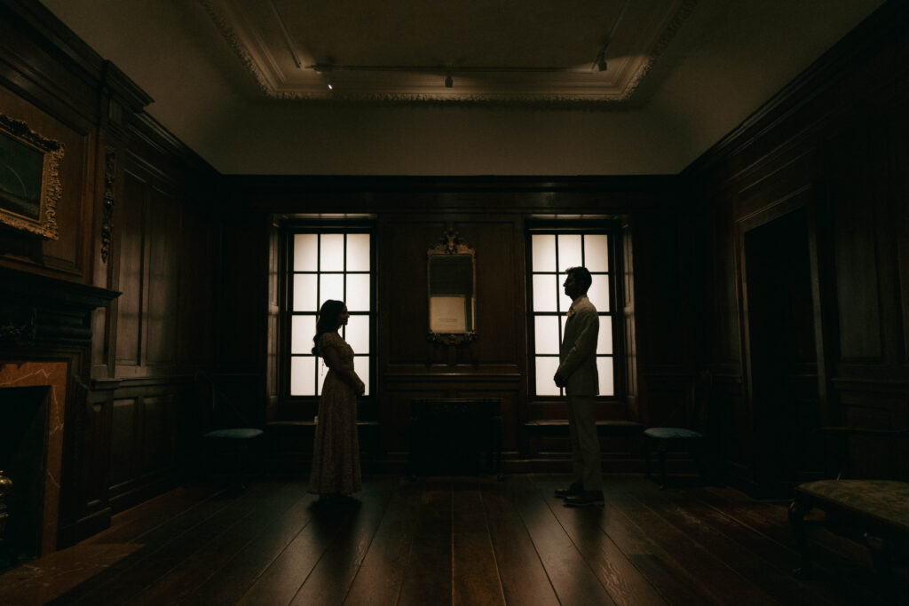 bride and groom silhouette portrait in museum