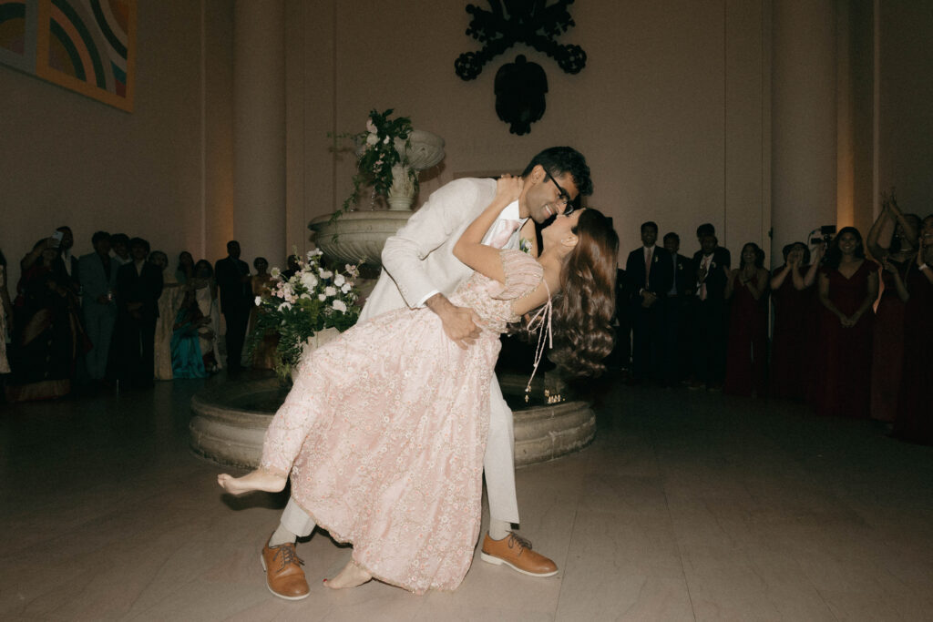 bride and groom dip during wedding dance