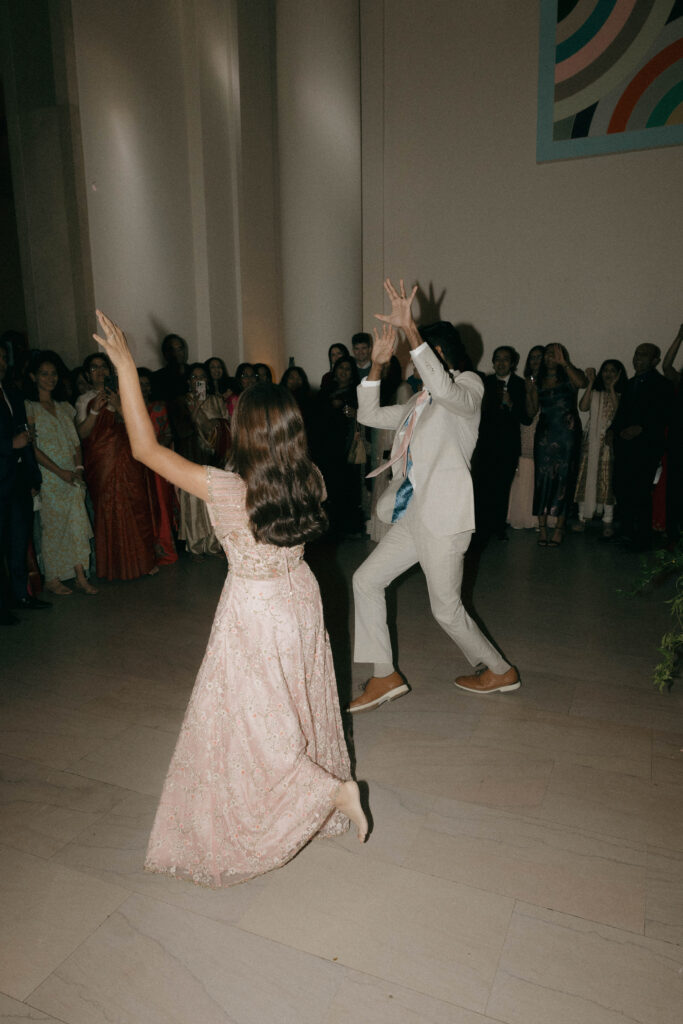 bride and groom traditional Indian wedding dance