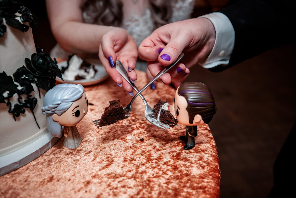 couple feeding cake to custom funko pops 