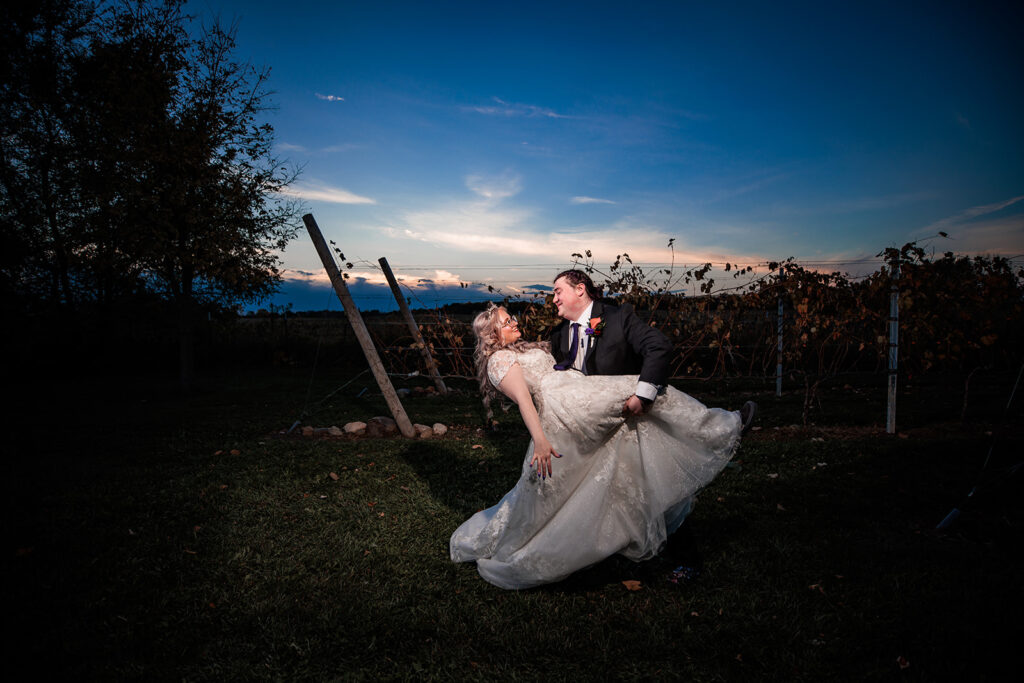 epic blue light portrait of bride and groom at October wedding at The Gardens