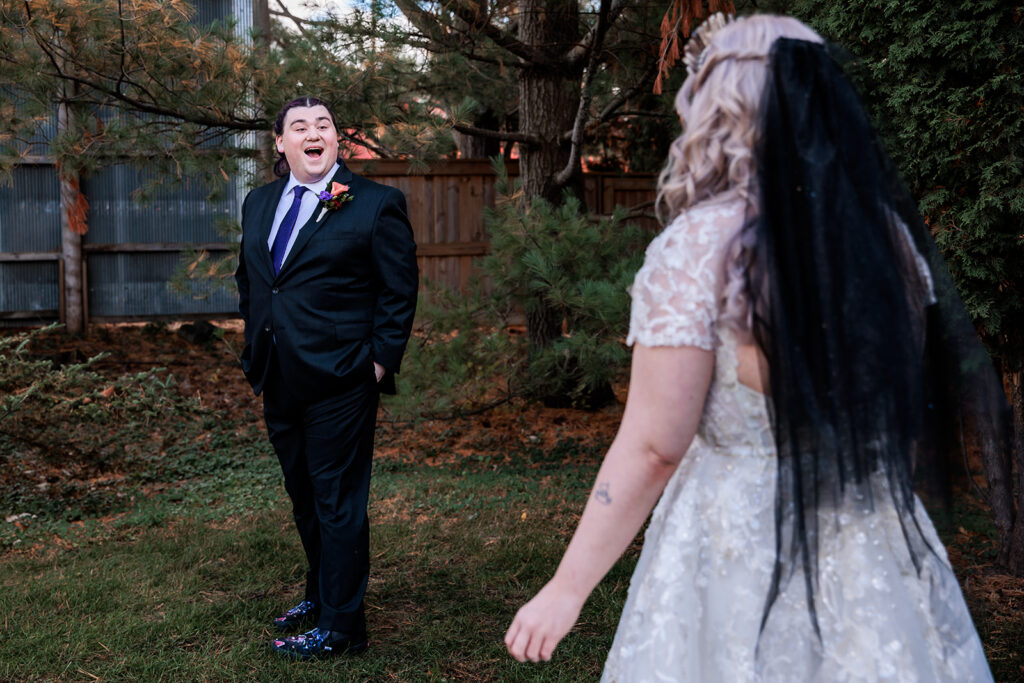 groom's excited reaction to bride during first look