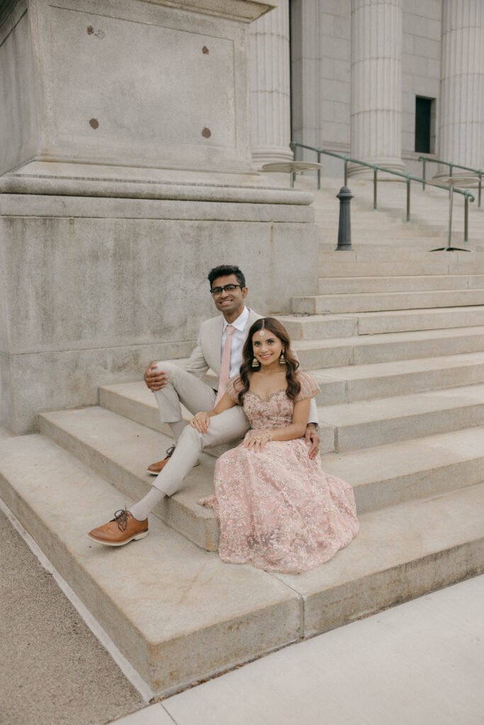 bride and groom sitting on steps outside of Minneapolis Institute of Art