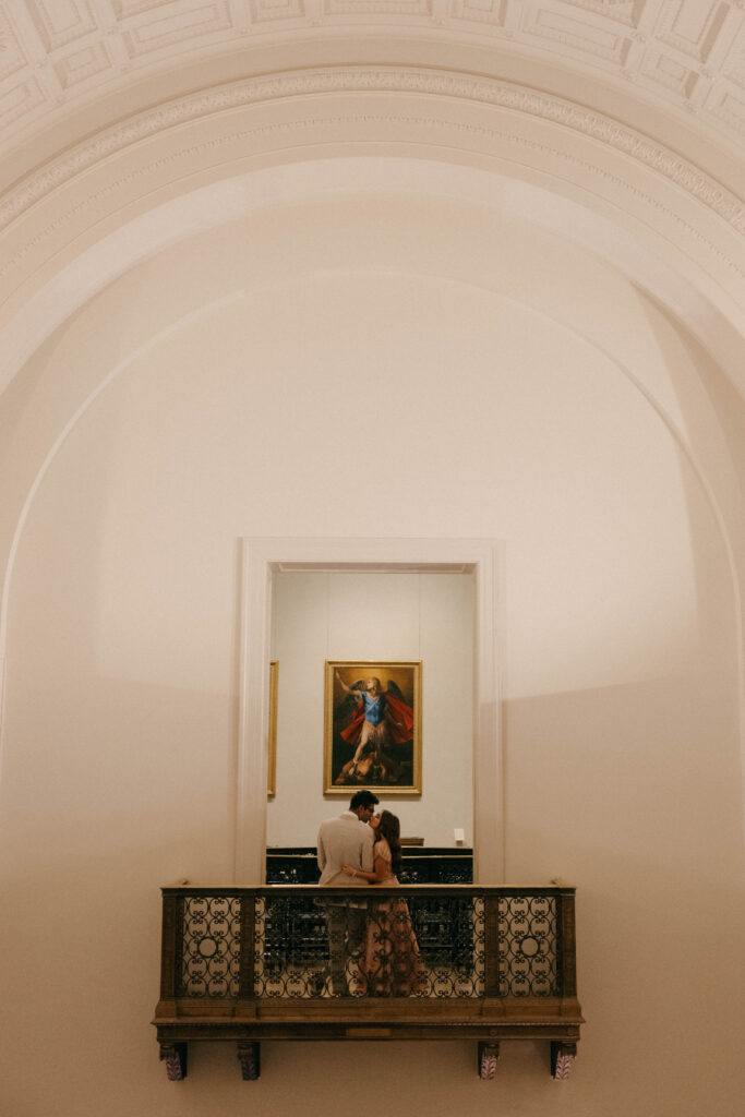 bride and groom portrait on balcony in art museum