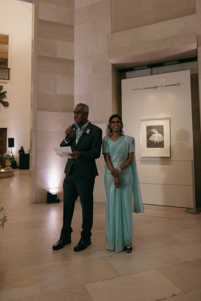 parents giving speech at non-traditional Indian wedding