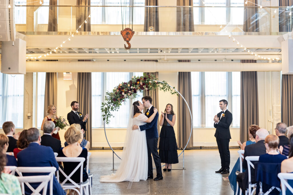 bride and groom ceremony kiss at Machine Shop wedding