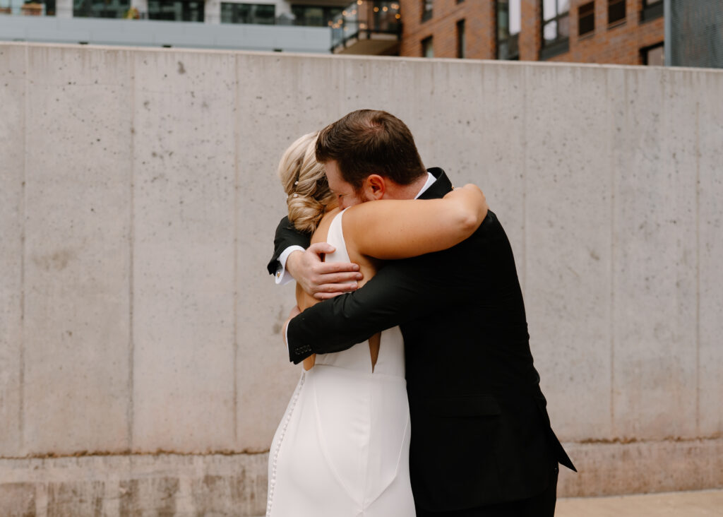 bride and groom intimate hug after first look