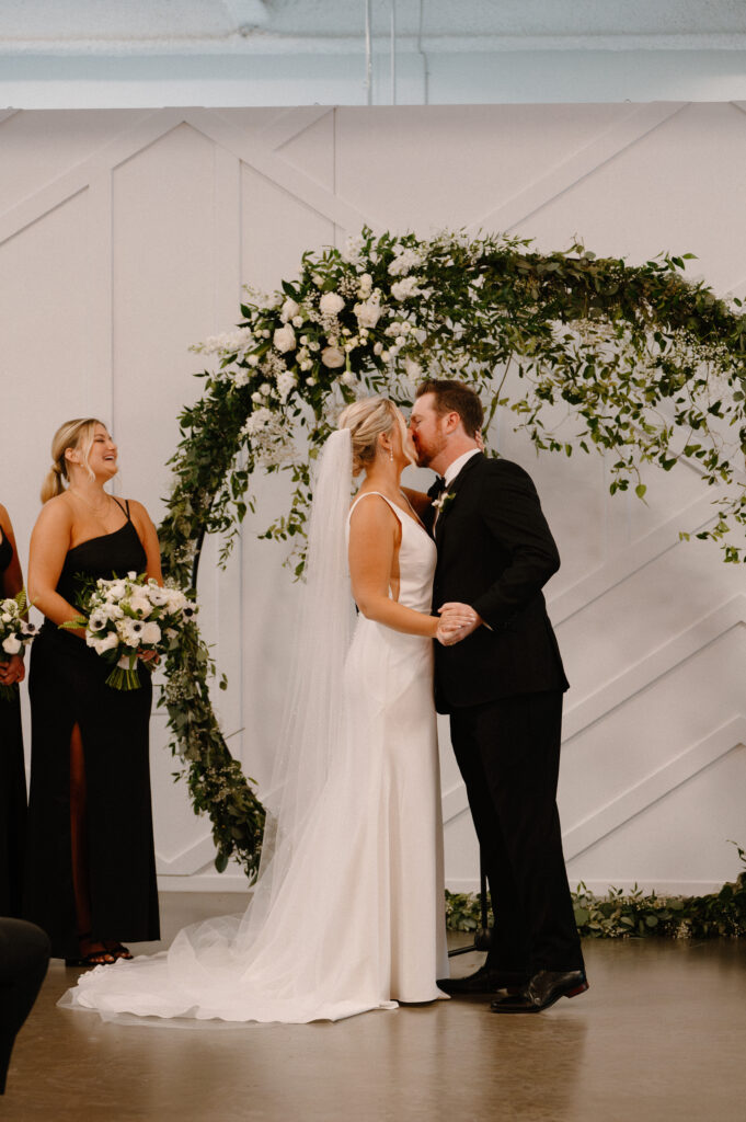 bride and groom ceremony kiss at Mosaic wedding