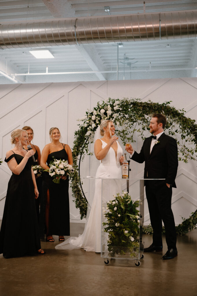 bride and groom cheers ceremony unity shot