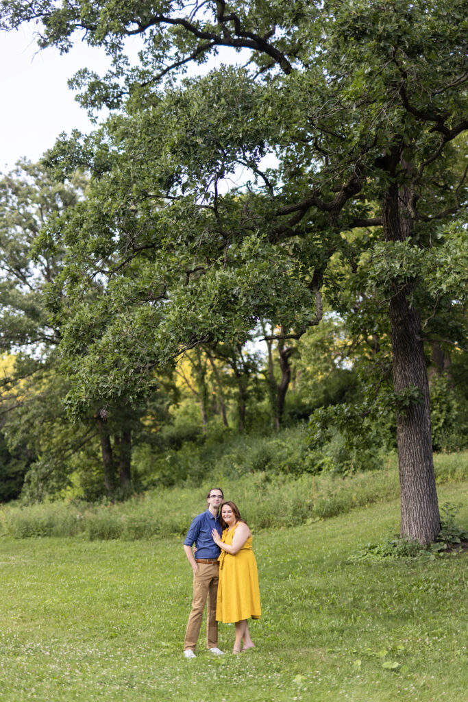 engagement photos under large tree in Minnehaha Park