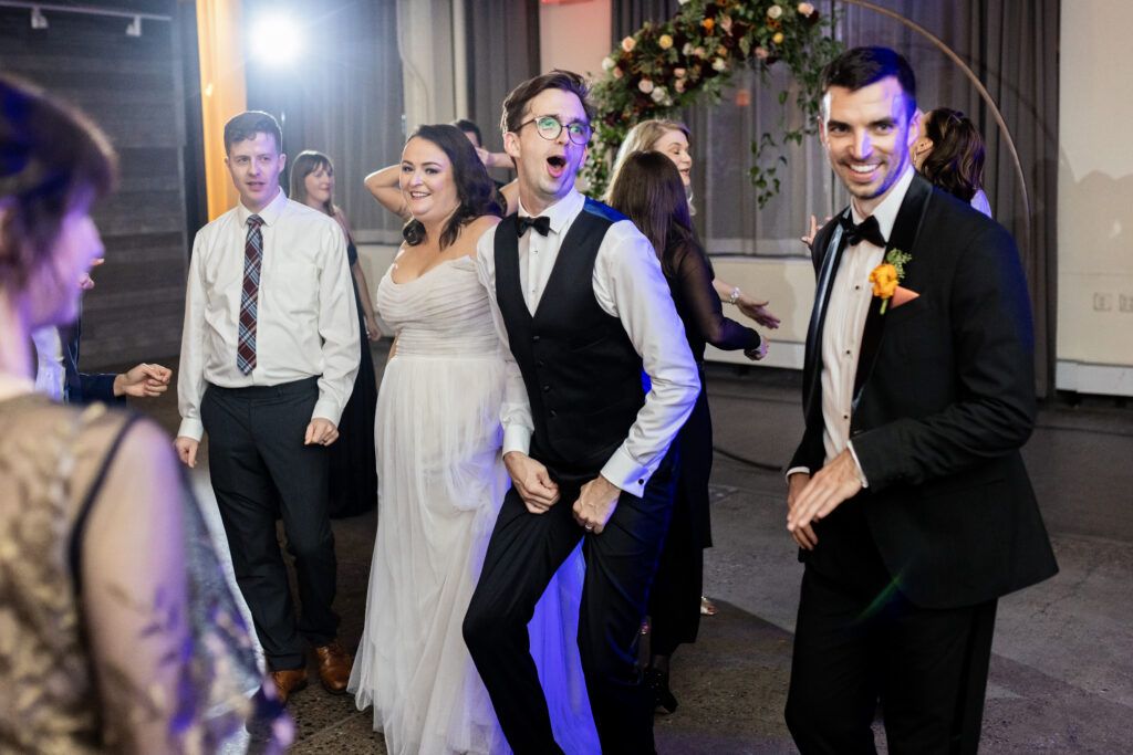 bride and groom dancing at wedding reception party